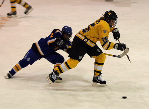 Margaret Dorner battles for control of the puck in the Gustie defensive zone.