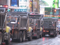 A fleet of dump trucks.