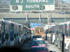 A line of busses leaving and entering New York City