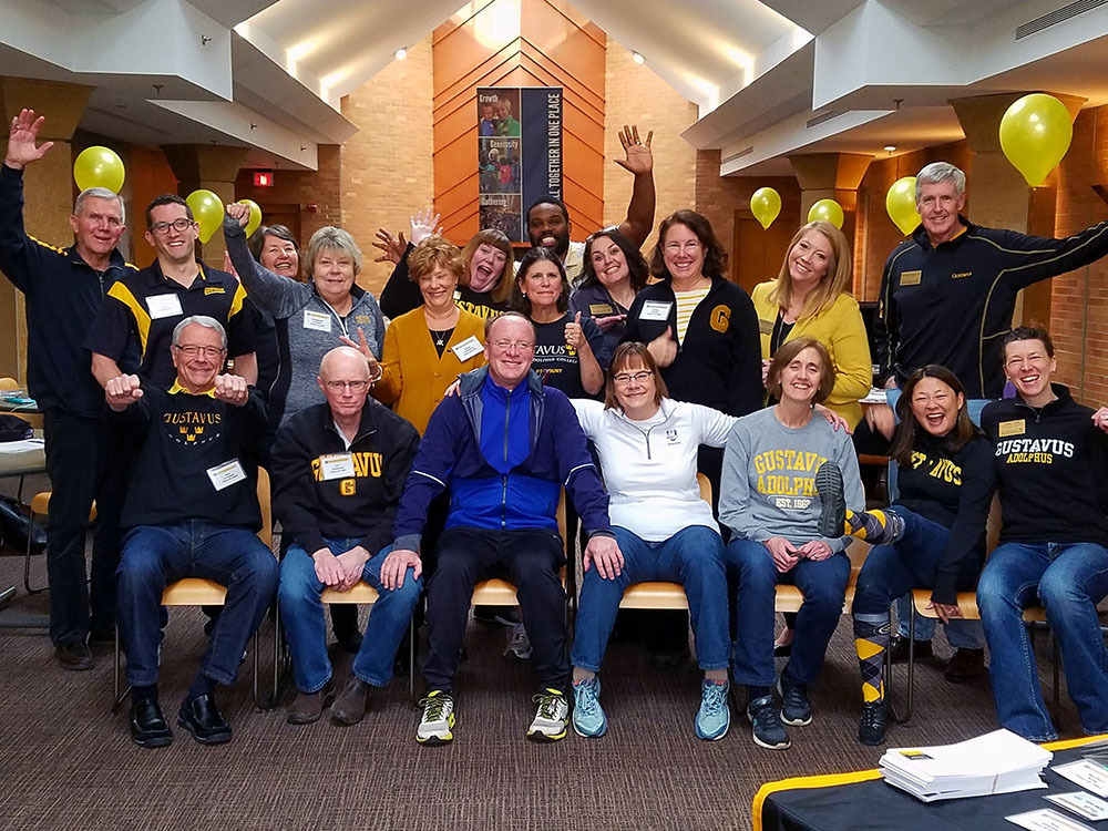 Gusties gathered together smiling for a group photo