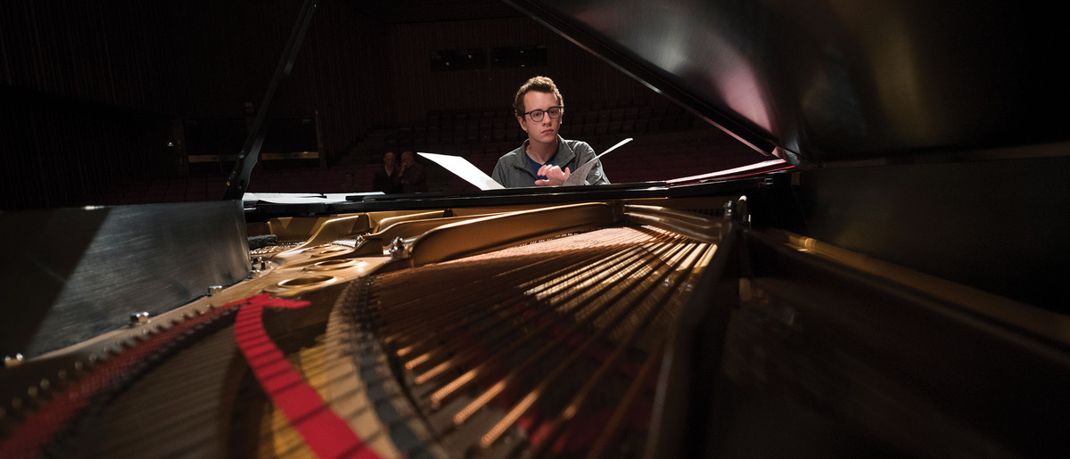 Close up of piano player.