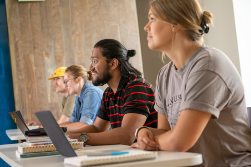 Row of Gustavus students in engaging in class.