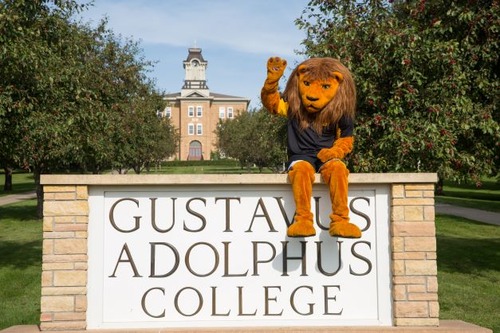 Gus mascot at Gustavus sign