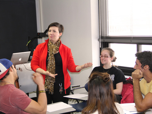 Angelique Dwyer, Associate Professor in Modern Languages, Literature, and Cultures and Spanish, and Chair in LALACS, leading a group of Gustavus students in a discussion.