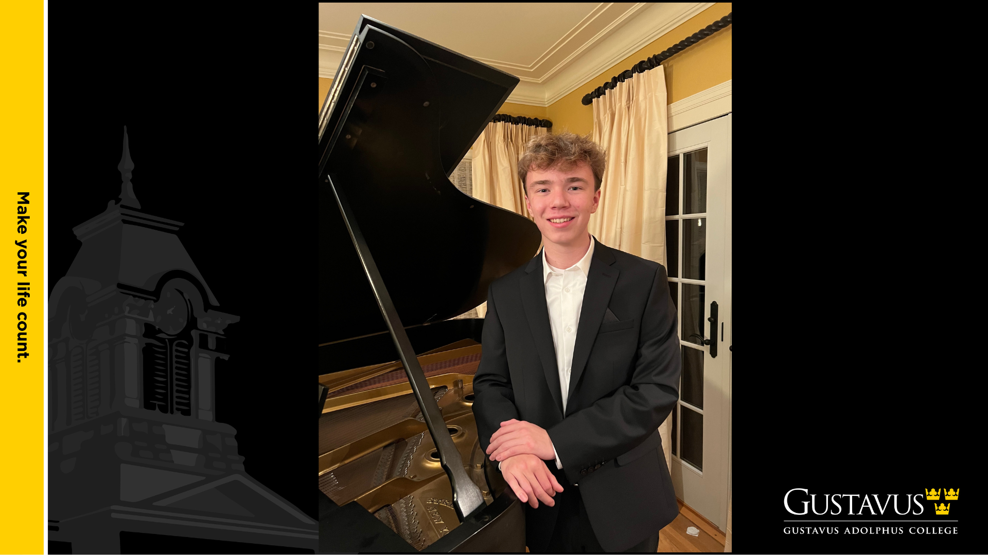 A young man in a suit smiles beside a grand piano in a warmly lit room, with Gustavus Adolphus College branding on the frame