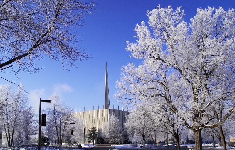 Christ Chapel during the winter with frosted trees and a blue sky