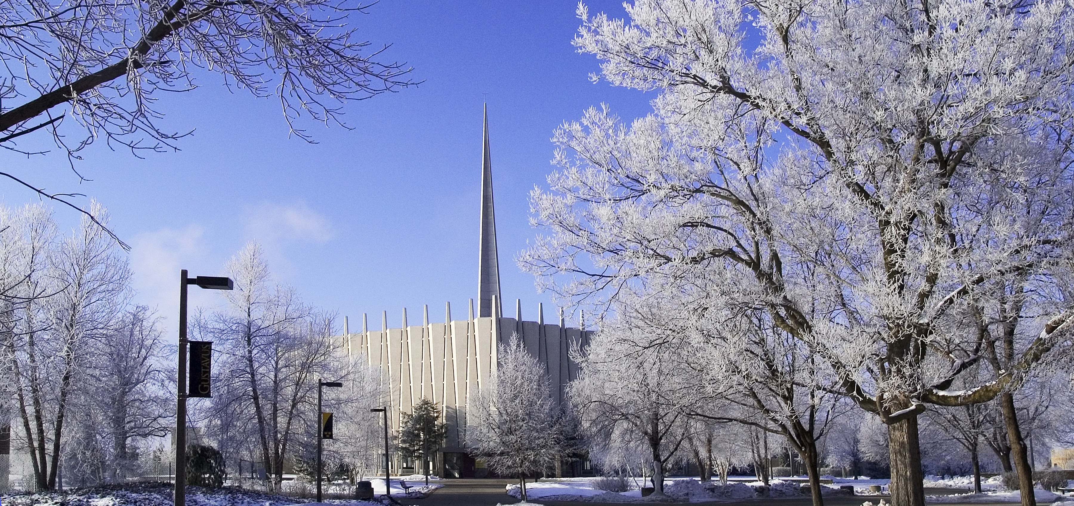 Christ Chapel during the winter with frosted trees and a blue sky