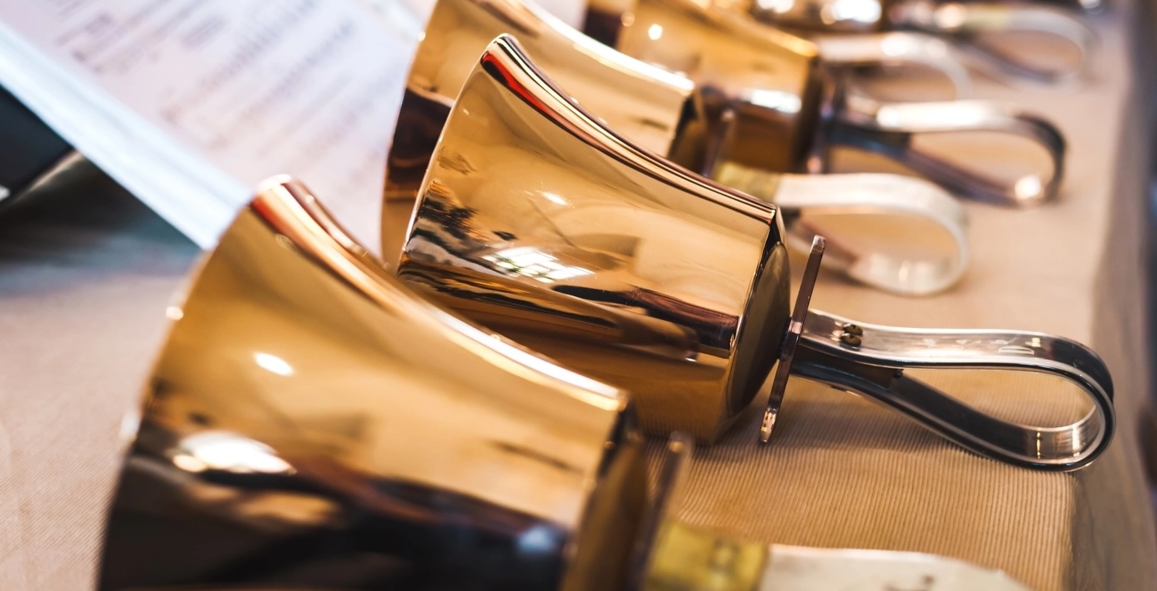 Brass handbells on a table