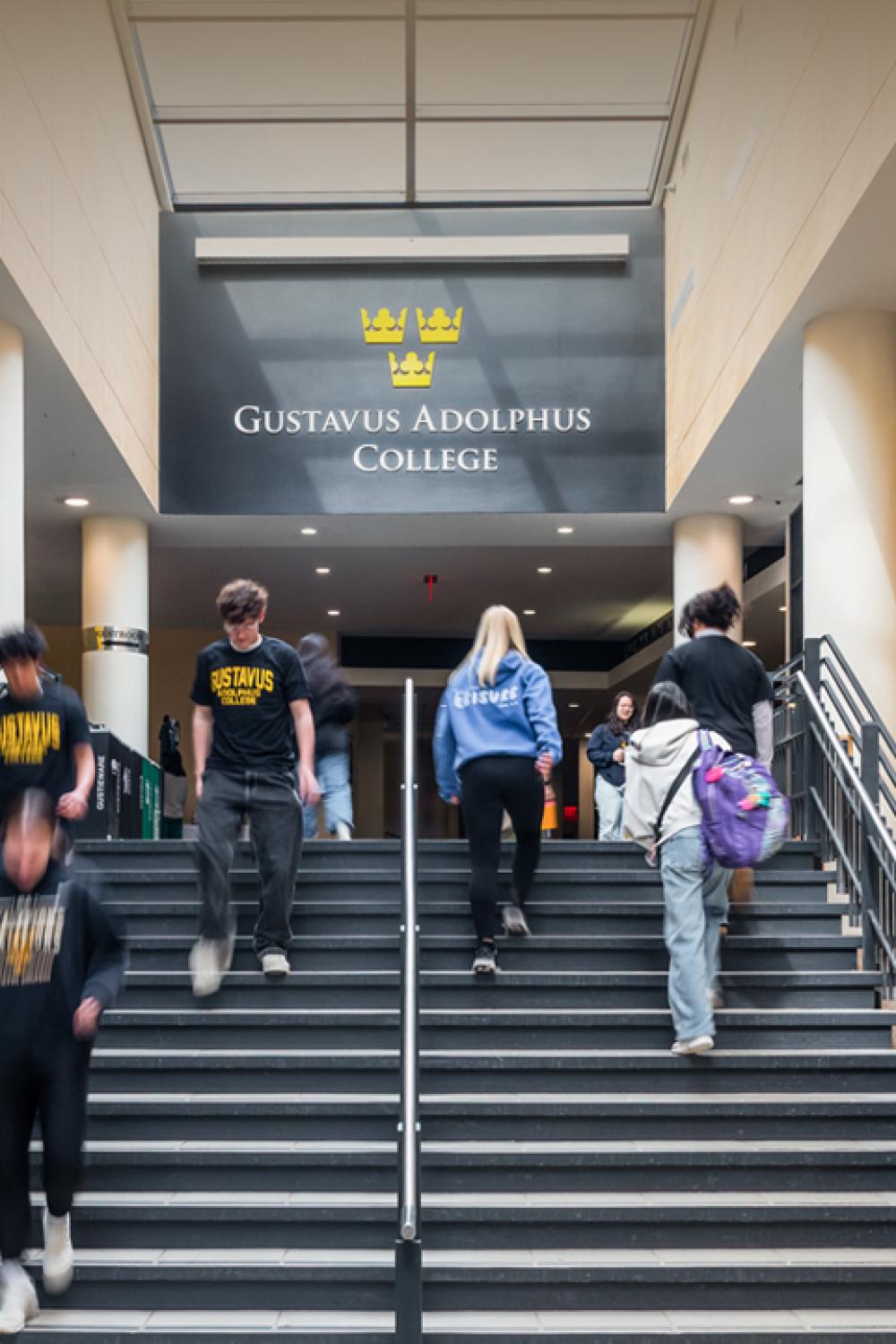 Visit campus students on campus center stairs
