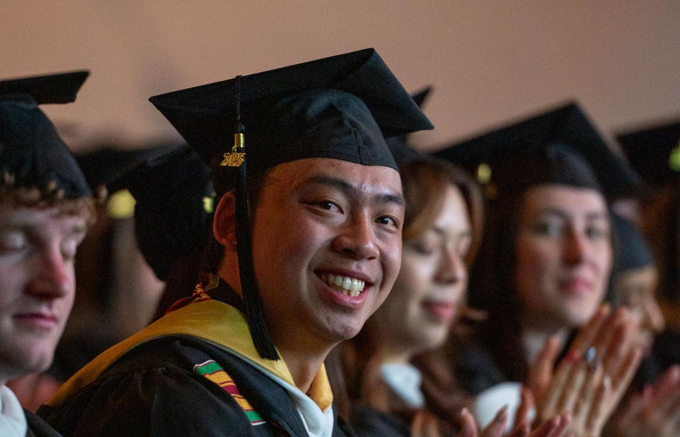 Commencement smiling student at ceremony