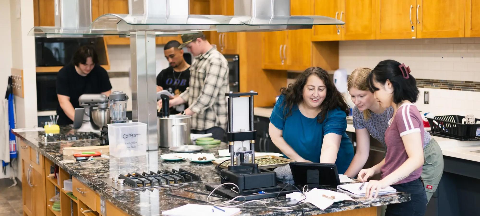 Students in class doing chemistry