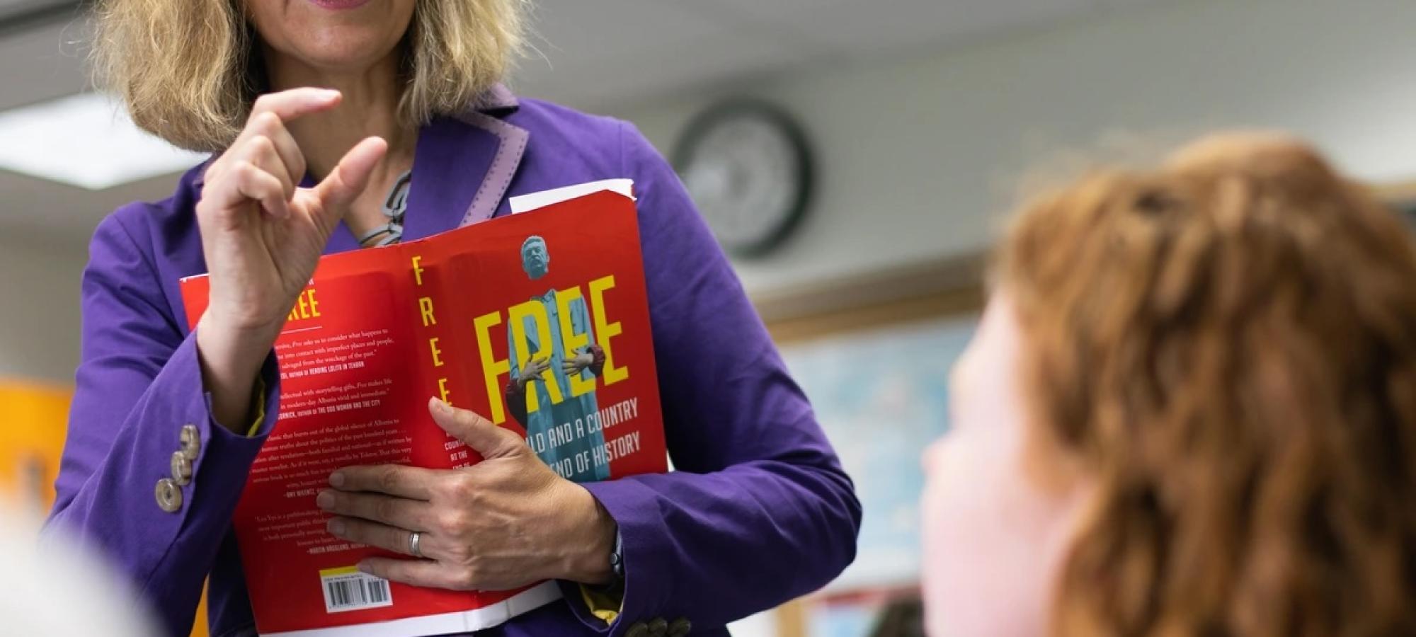 teacher speaking to student