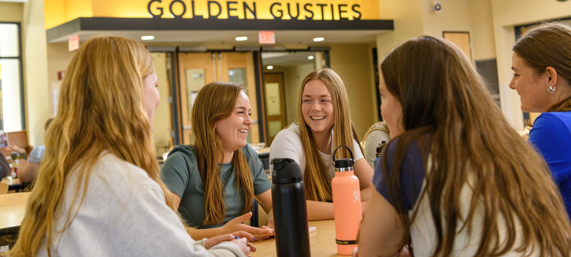 Students at table in dining room