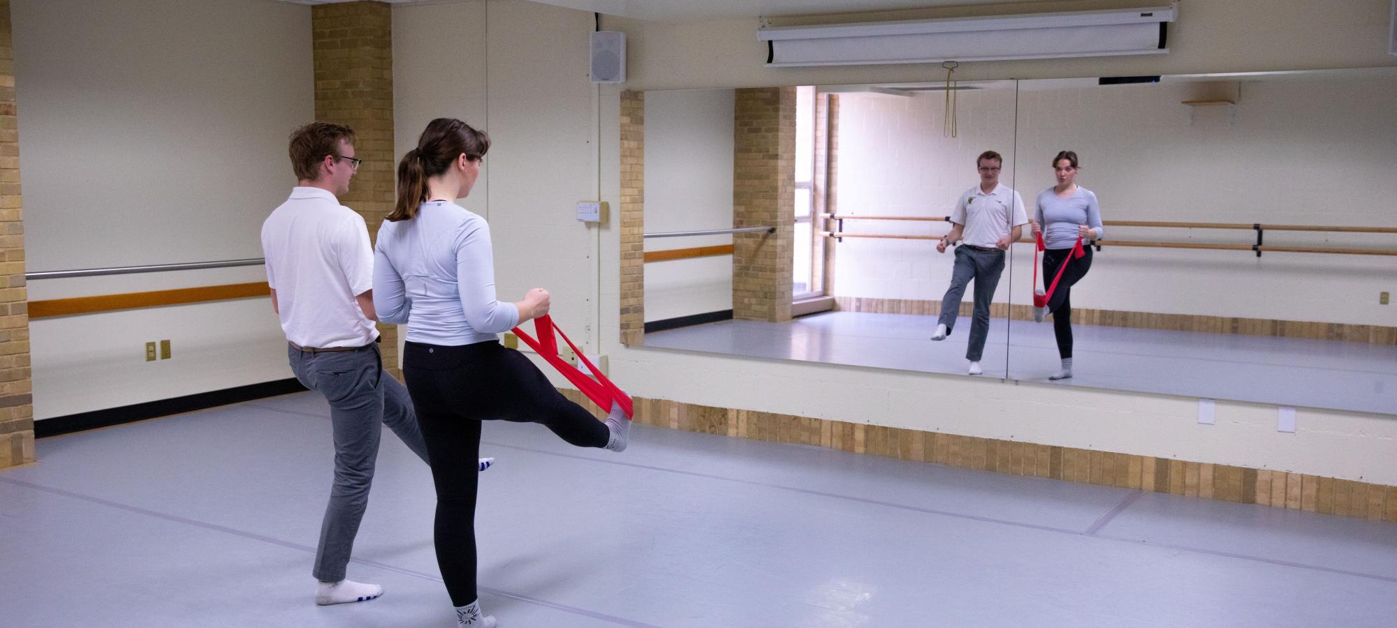 Athletic trainer with dancer