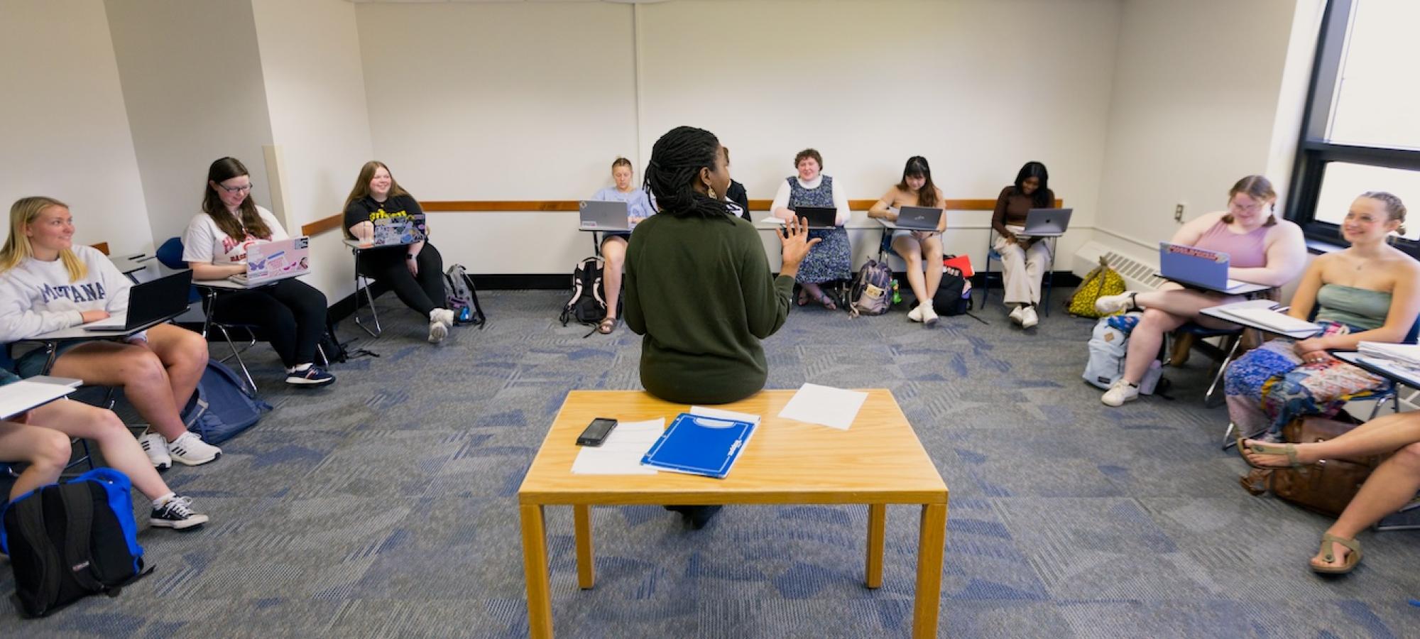 A Gustavus Adolphus College professor teaches a class. 