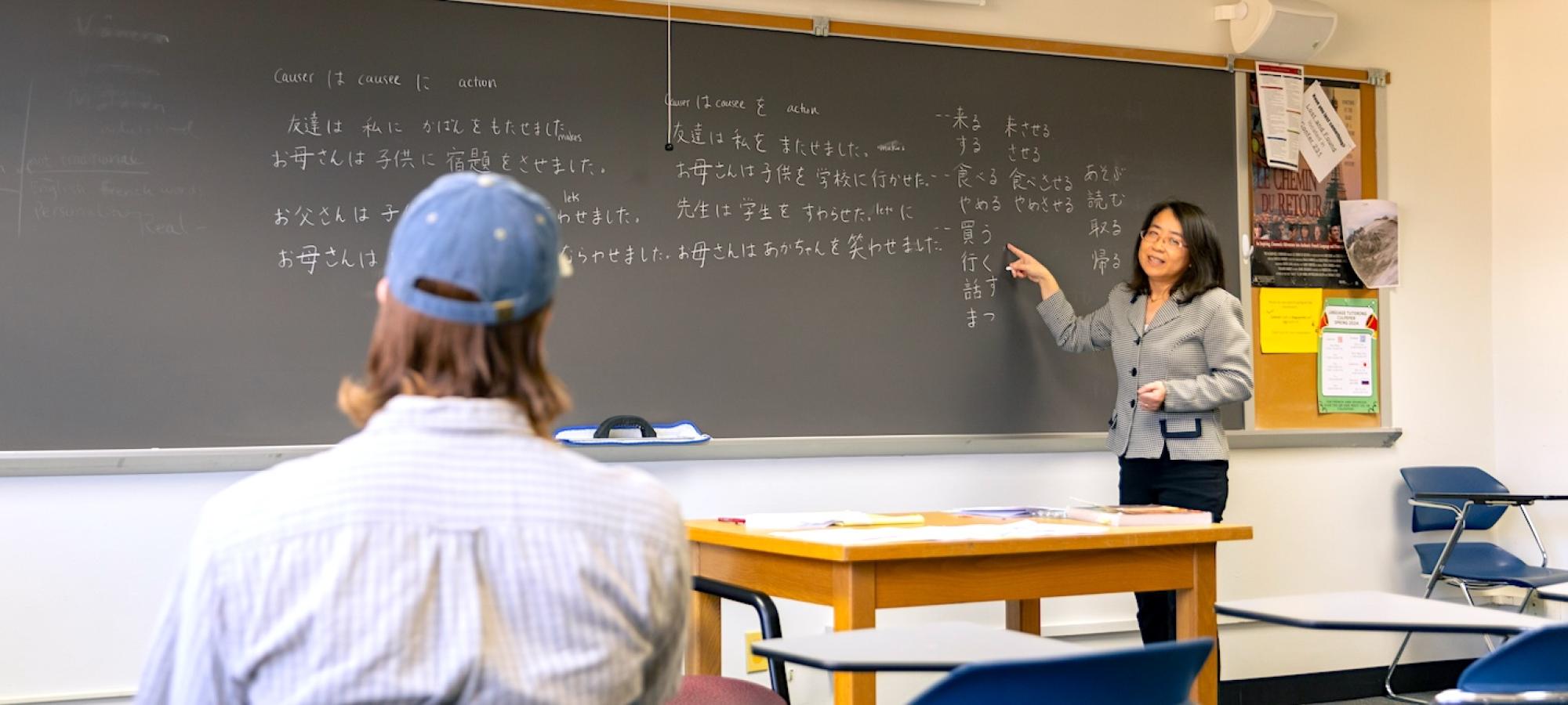 A Gustavus Adolphus College Japanese professor helps a student with vocabulary. 