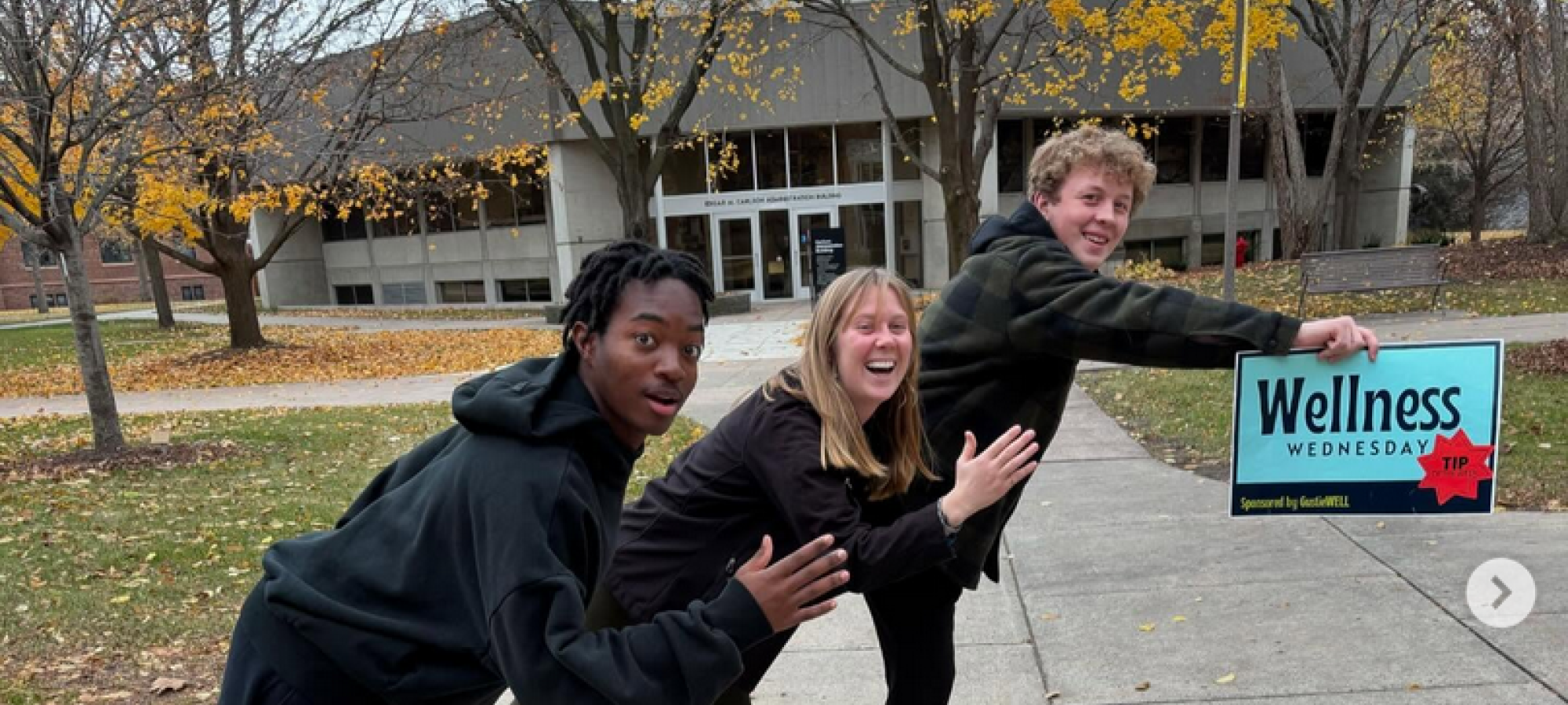 Peer assistants in front of Administration building
