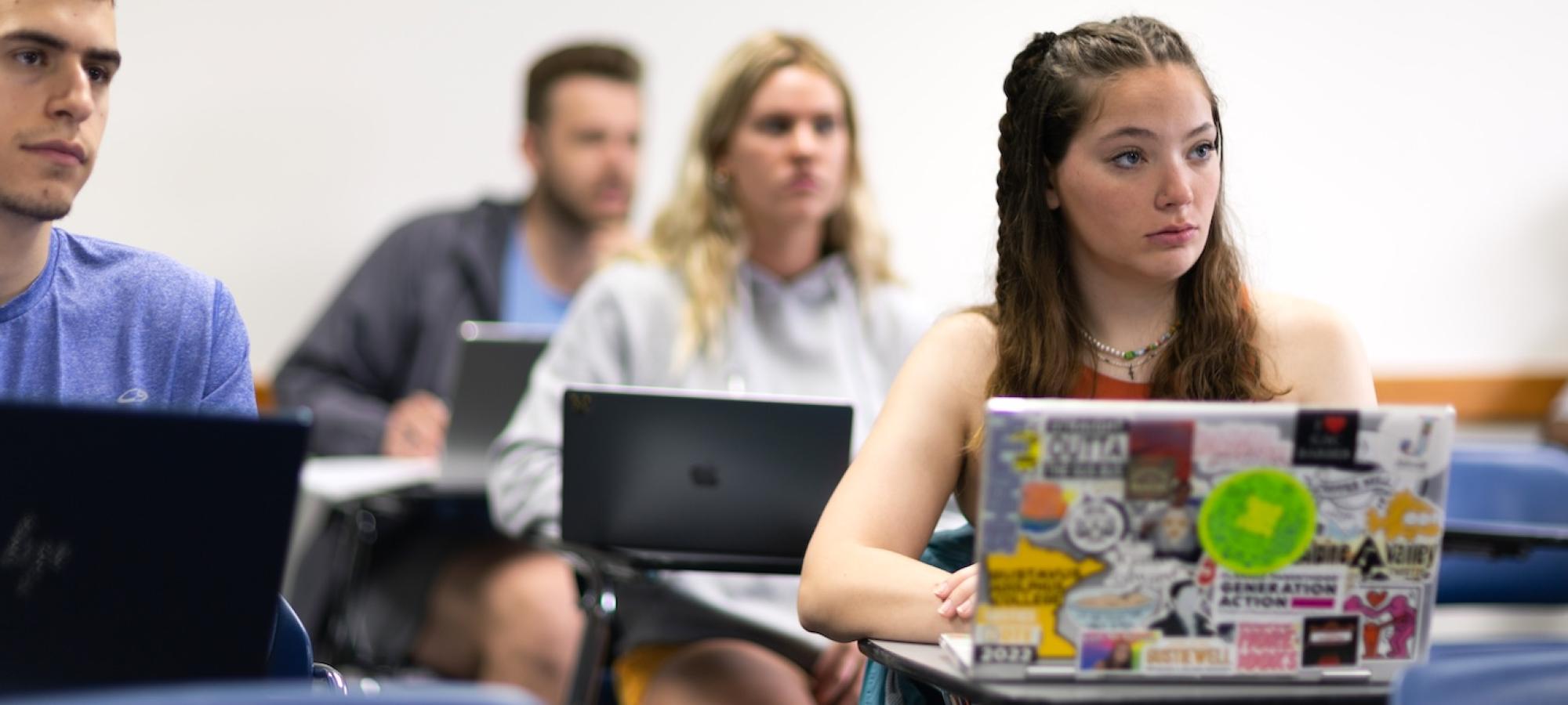 A student listens intently in class. 