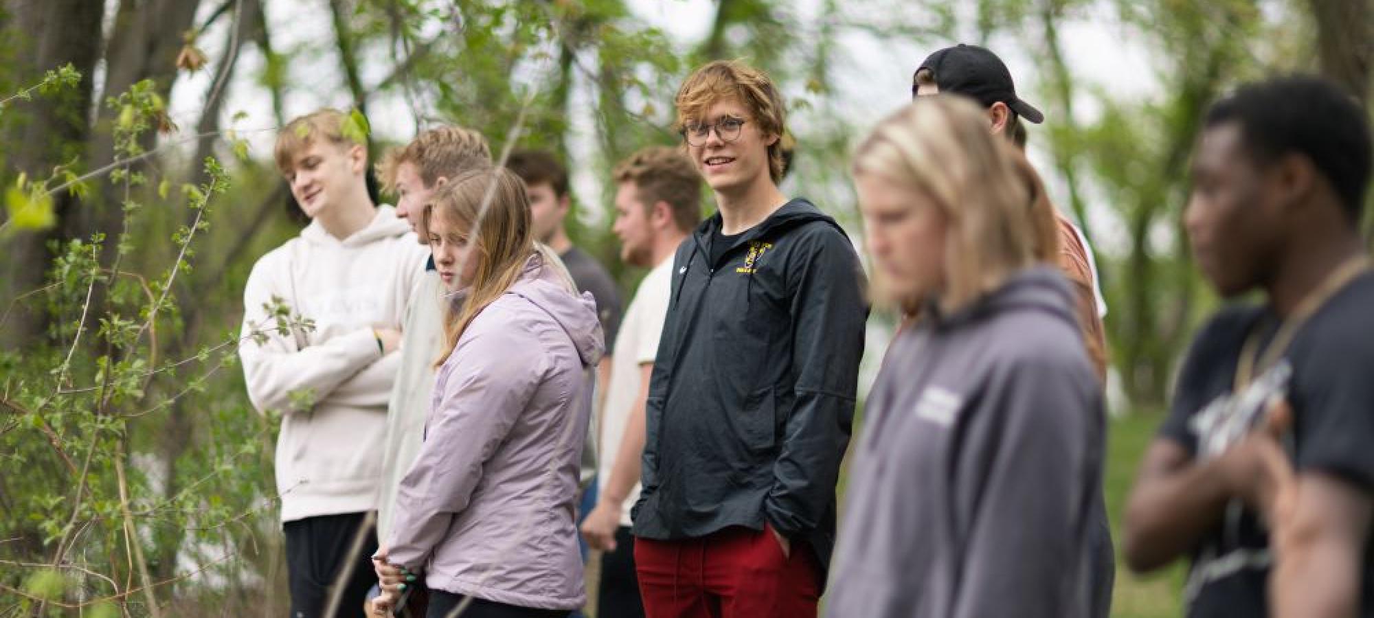 Geography students on field trip in woods