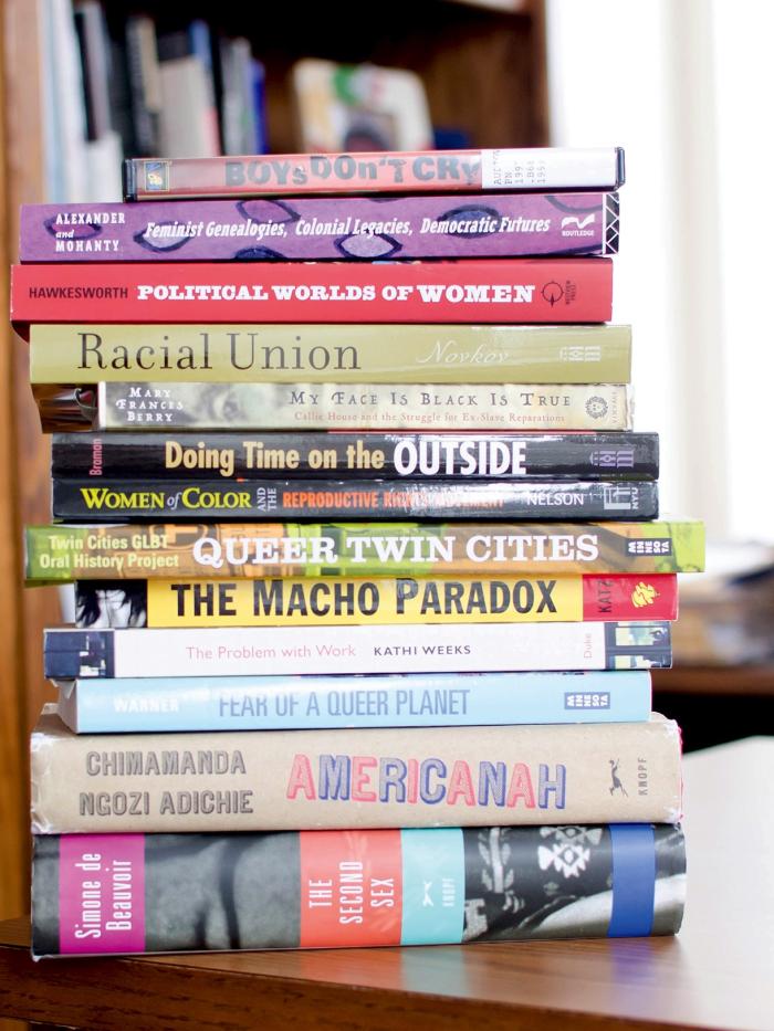 A stack of books that would be read in gender, women, and sexuality studies. 