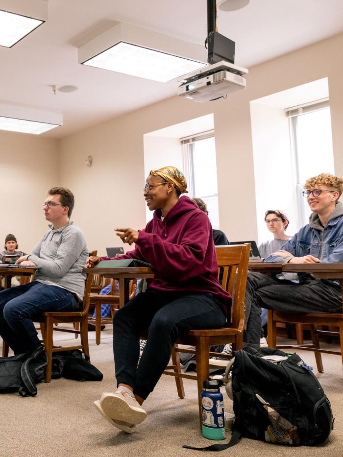 philosophy class with student and faculty