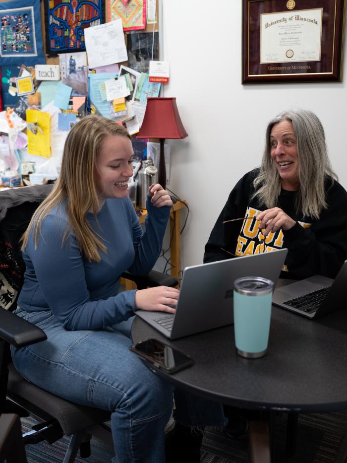 Student and advisor working on goals