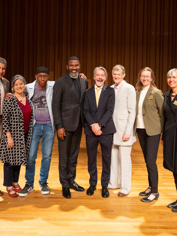 Symposium speakers with President John Volin
