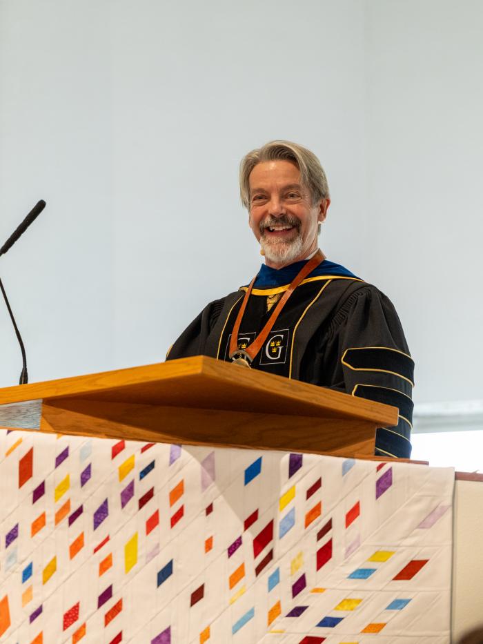 John Volin at podium in chapel at his inauguration ceremony